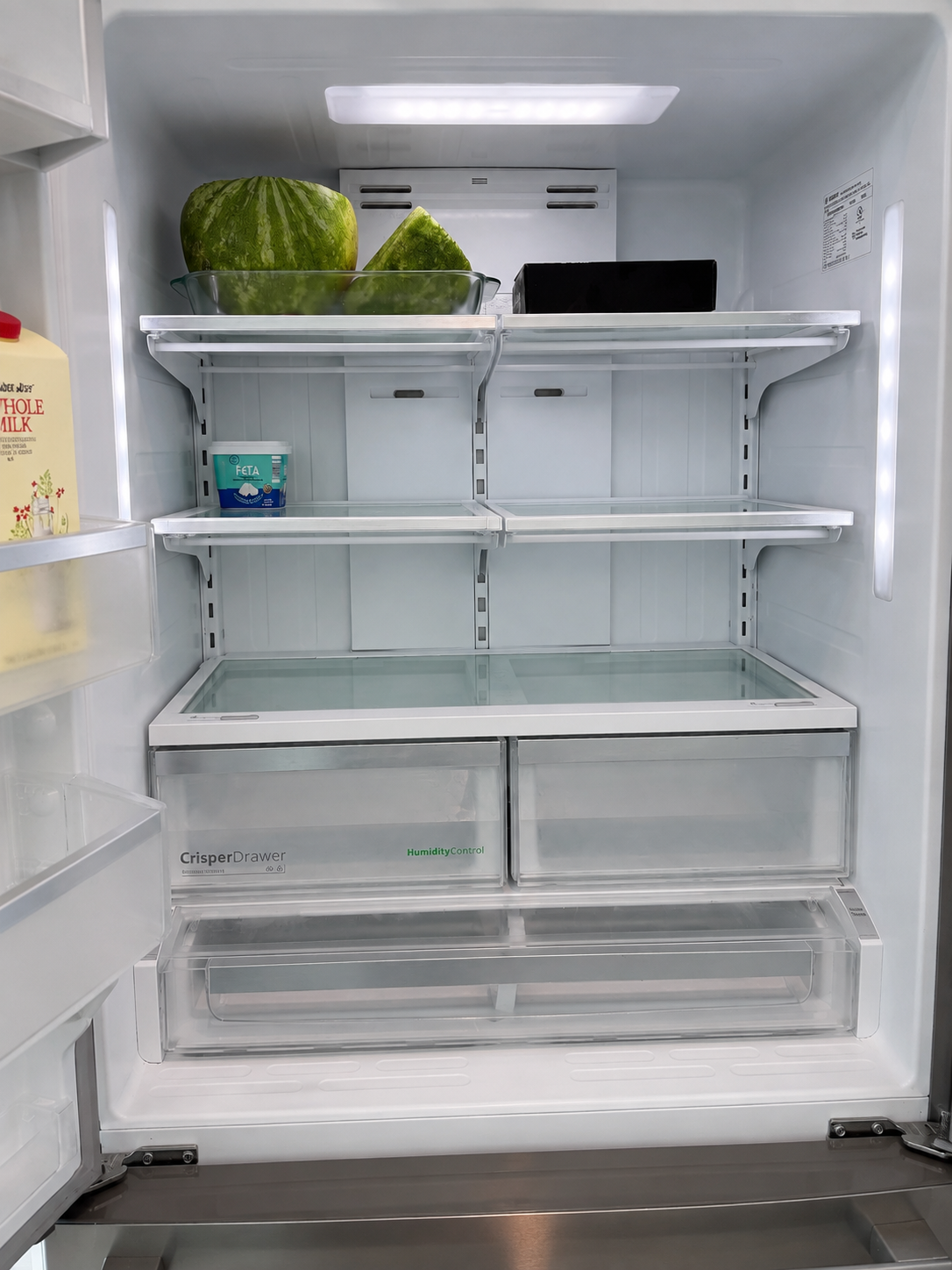 Spotless refrigerator shelves and crisper drawers after cleaning