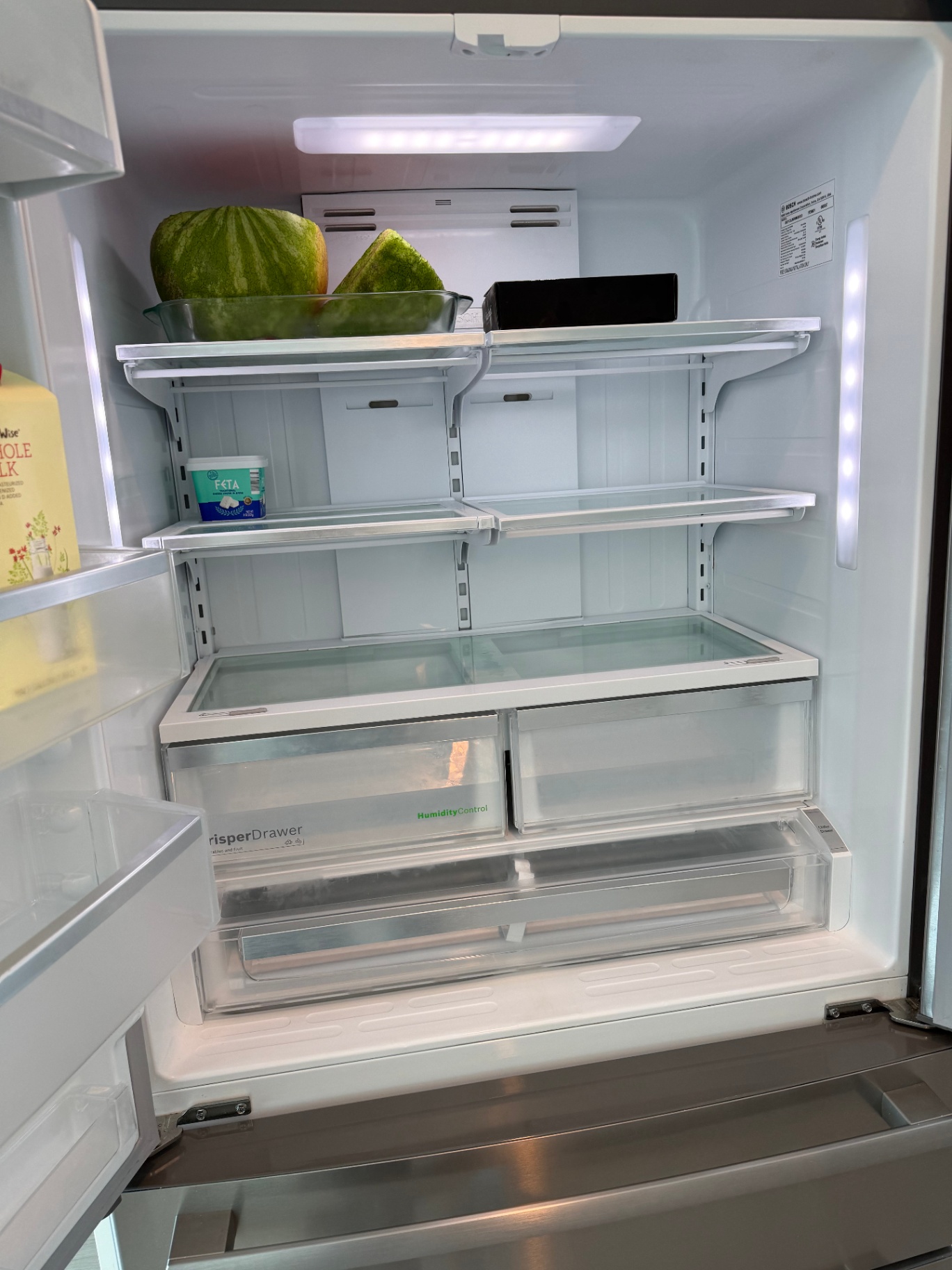Refrigerator interior spotless and organized after cleaning