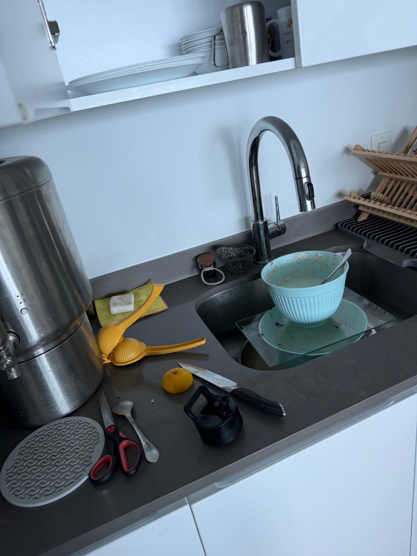 Kitchen sink full of dirty dishes before a Magic Clean Miami visit