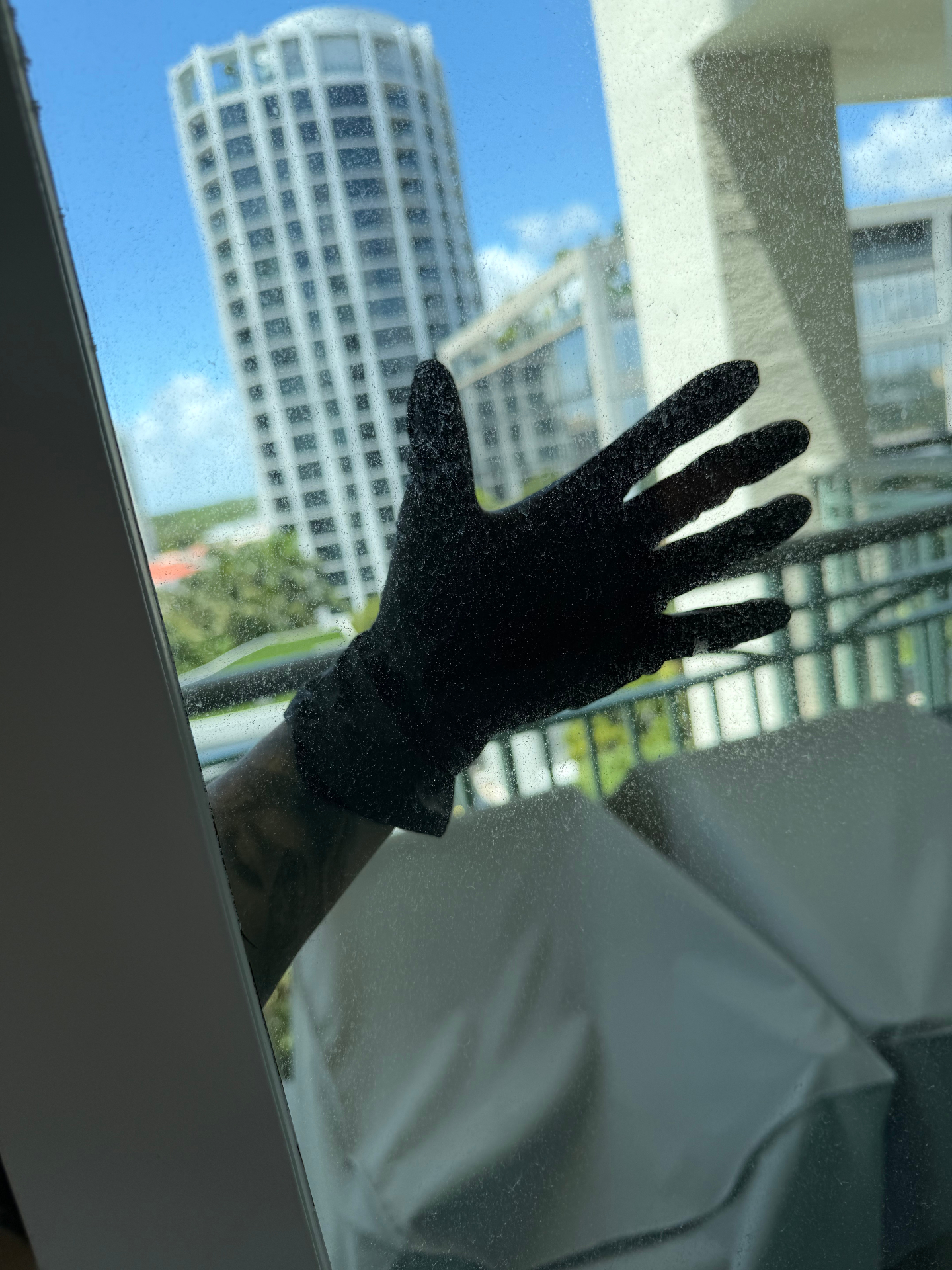 Dusty condo window glass before professional window cleaning