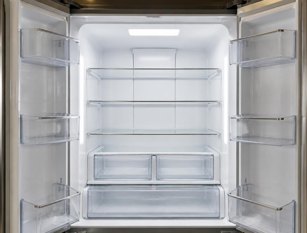 Spotless empty refrigerator interior after an Airbnb turnover cleaning