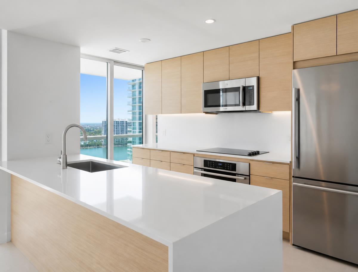 Spotless Miami condo kitchen with clean oven and microwave after a turnover cleaning
